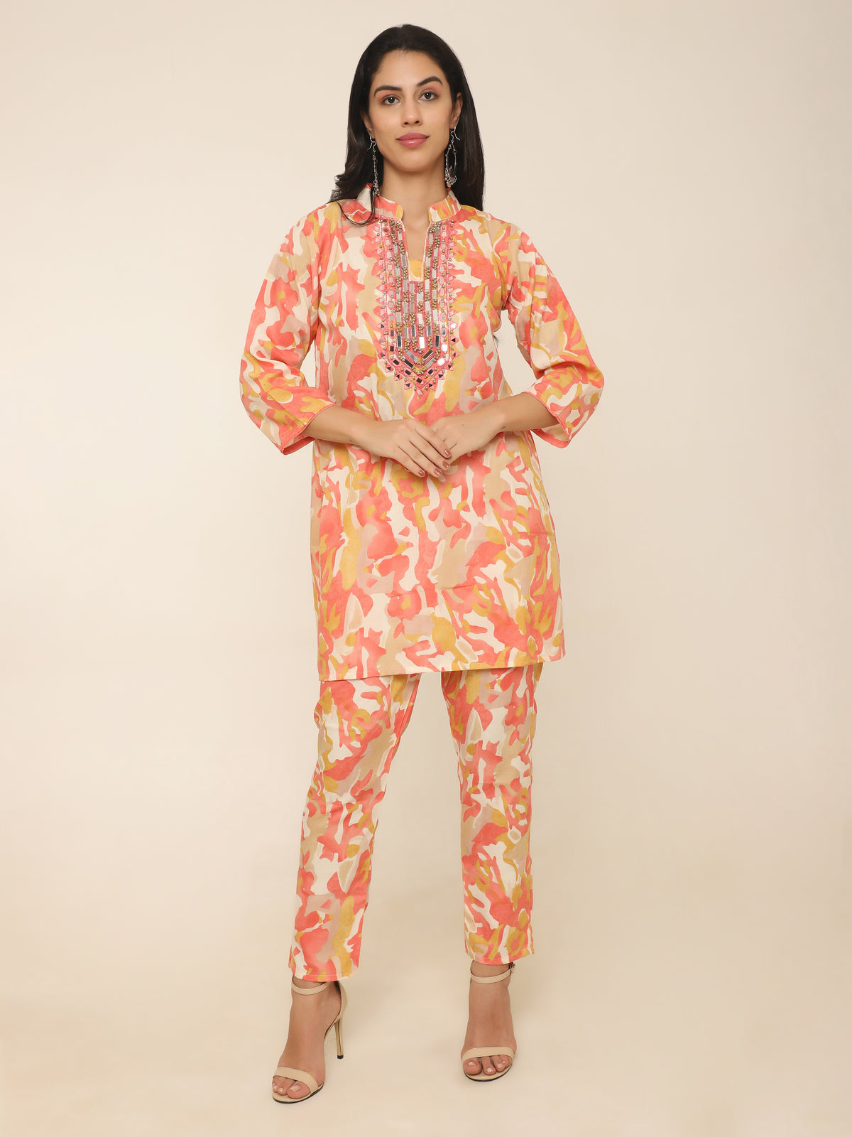 Vibrant orange cotton co-ord set with mirror work and beads detail.
