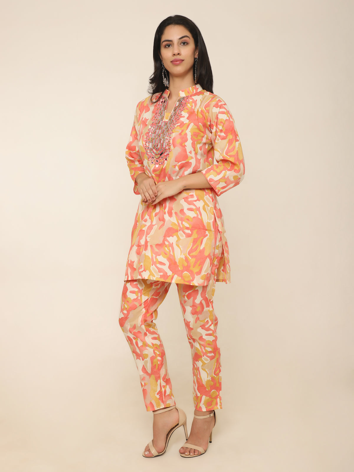 Vibrant orange cotton co-ord set with mirror work and beads detail.