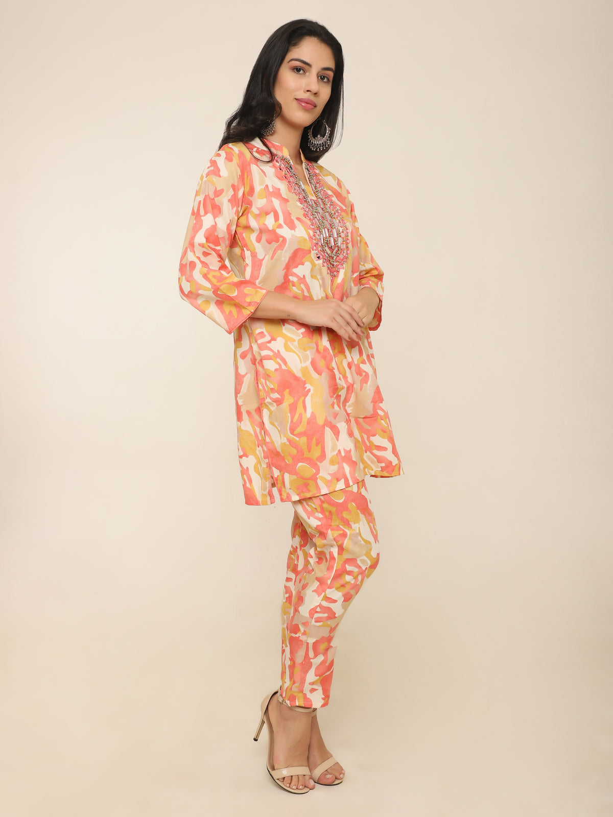 Vibrant orange cotton co-ord set with mirror work and beads detail.