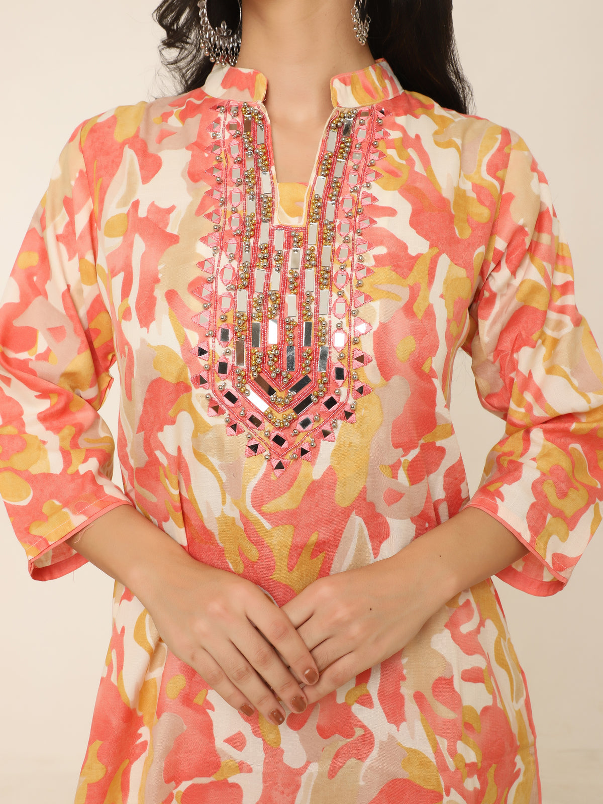 Vibrant orange cotton co-ord set with mirror work and beads detail.